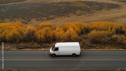 Prison transport van driving through a remote area on its way to a facility, Prison transportation, remote confinement photo