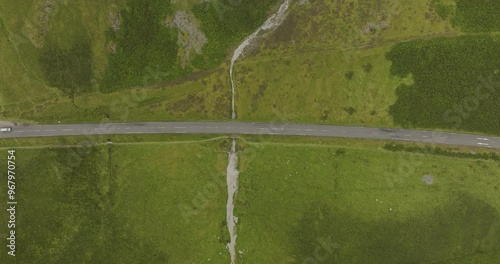 Aerial view of Loch Achtriochtan with a winding road and lush green landscape, Ballachulish, Scotland. photo