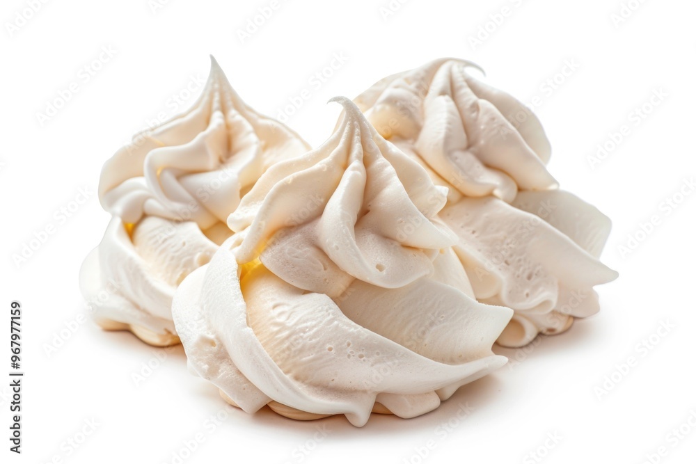 A close-up shot of creamy whipped topping on a white background A close-up shot of creamy whipped topping on a white background