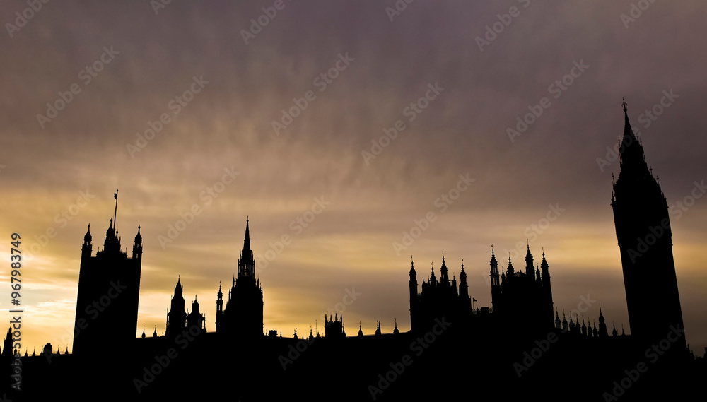 Silhouette of historic London buildings at sunset showcasing intricate architecture and towers. The dramatic silhouette of London's iconic Houses of Parliament and Big Ben. Silhouette of historic London buildings at sunset showcasing intricate architecture and towers. The dramatic silhouette of London's iconic Houses of Parliament and Big Ben.