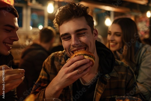 A person enjoying a meal, with a companion observing nearby photo