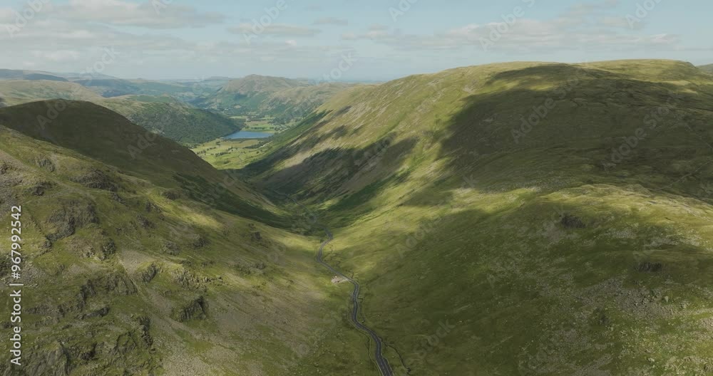 Aerial view of kirkstone pass with beautiful mountains and serene valley, Lake District, United Kingdom. Aerial view of kirkstone pass with beautiful mountains and serene valley, Lake District, United Kingdom.
