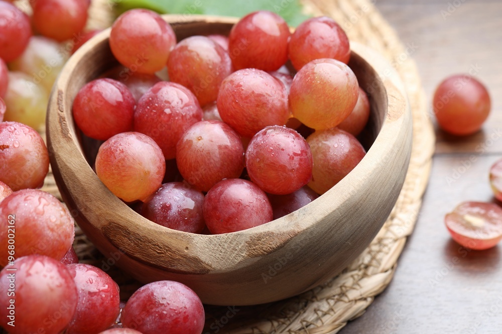 Fresh ripe grapes on wooden table, closeup Fresh ripe grapes on wooden table, closeup