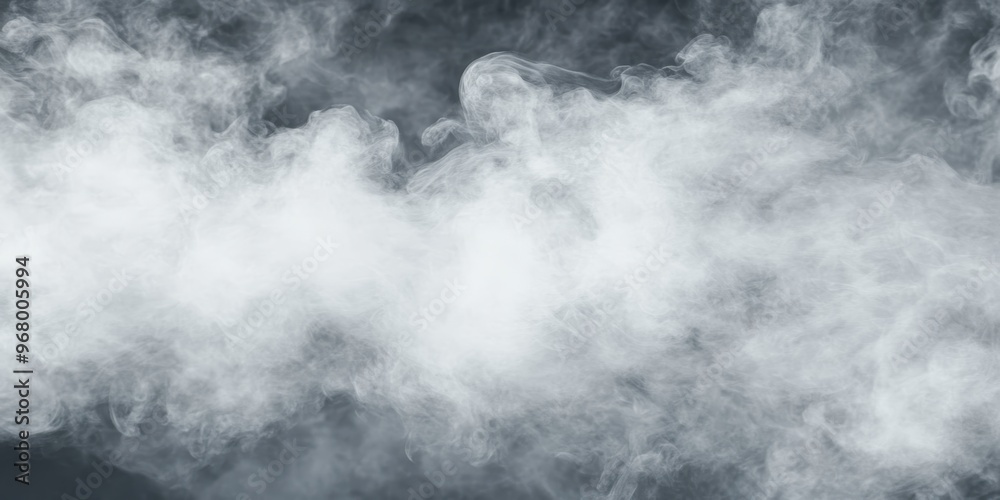 Fototapeta premium Delicate white smoke swirls and flows gracefully against a dark background, adding an element of mystery to the surroundings
