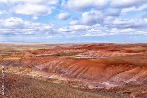 Akzhar Ulytau chalk mountains in the desert of Kazakhstan. Rare sandy hills with many multi-colored layers of clay, sand, chalk and gravel of bizarre shape far from civilization with sparse vegetation