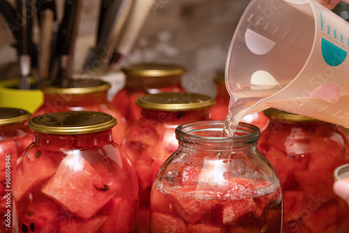 Preparation of homemade canned pickles - salted watermelons in jars