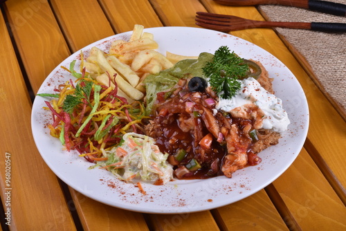 Fried chicken schnitzel cordon bleu with cheese in breadcrumbs is restaurant food. Delicious tender chicken chnitzel with homemade french-fries photo