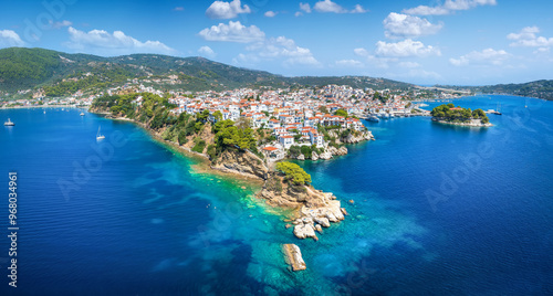 Fototapeta Naklejka Na Ścianę i Meble -  Panoramic summer view of the old harbor and town of Skiathos island, Sporades, Greece, with Bourtzi peninsula and Plakes area in front 