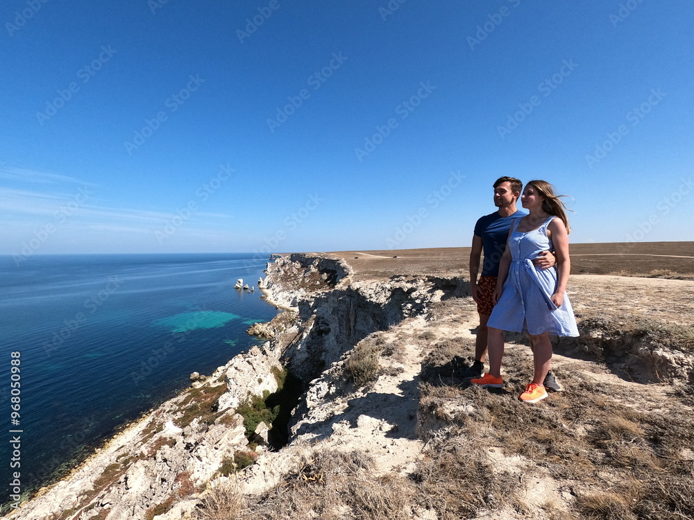 couple taking selfie on jangul landslide coast, crimea, beautiful sea cliff landscape, sunny summer day, travel adventure, scenic view, happy tourists, coastal exploration, nature couple taking selfie on jangul landslide coast, crimea, beautiful sea cliff landscape, sunny summer day, travel adventure, scenic view, happy tourists, coastal exploration, nature