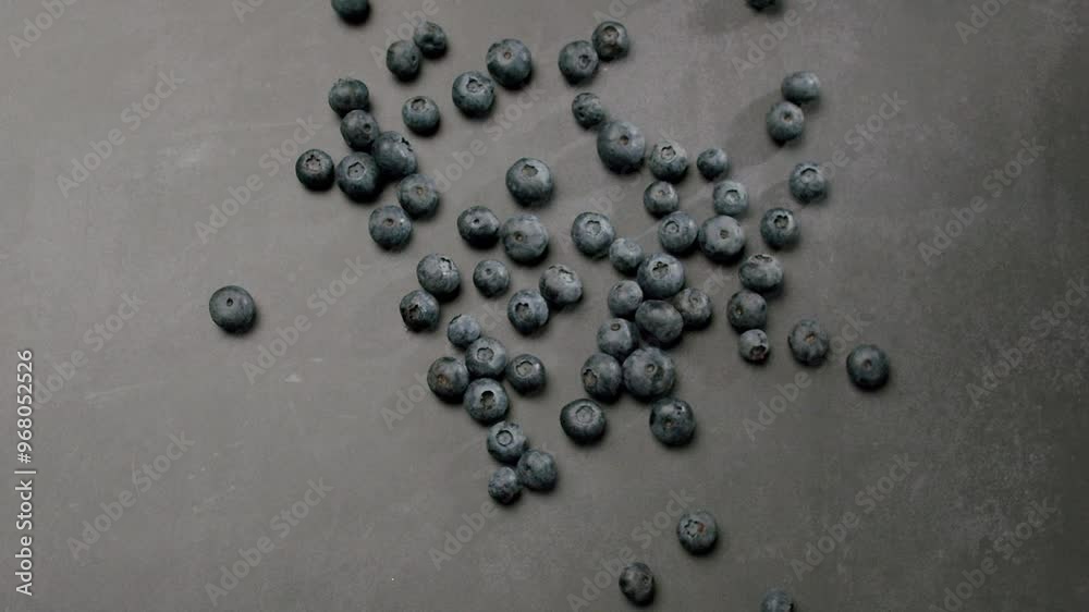 Freshly harvested blueberries scattered across a gray surface, embodying healthy eating and fresh produce concepts. Perfect for culinary and health-related visuals. Fresh Blueberries Freshly harvested blueberries scattered across a gray surface, embodying healthy eating and fresh produce concepts. Perfect for culinary and health-related visuals. Fresh Blueberries