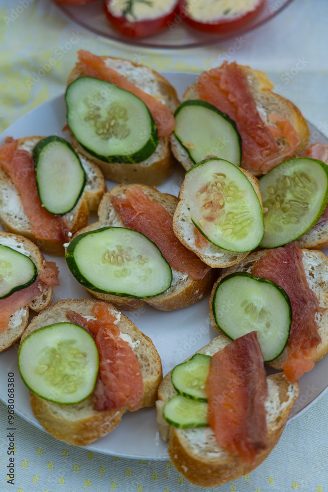 Sandwiches with red fish and cucumber. Red fish and cucumber appetizer
