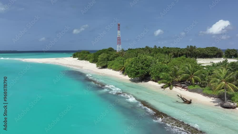 Aerial view of serene local island with sandy beach, turquoise water, and palm trees, Vashafaru, Maldives. Aerial view of serene local island with sandy beach, turquoise water, and palm trees, Vashafaru, Maldives.