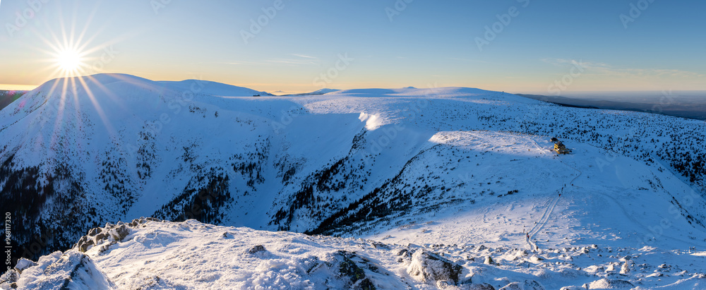 panoramic view on Giant mountains at winter sunset in Poland