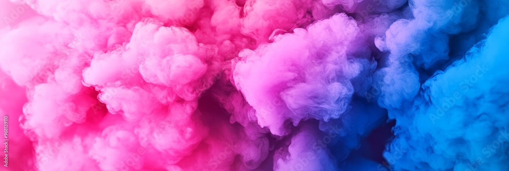 Fototapeta premium This abstract watercolor background features a blend of pink and blue hues, creating a dreamy and ethereal atmosphere. The colors swirl and blend together, evoking a sense of movement and energy.