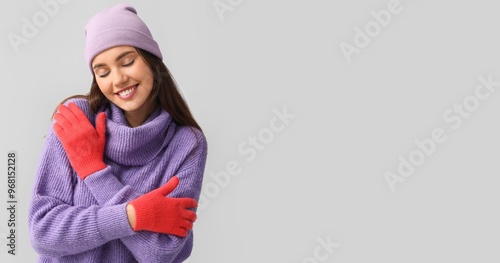 Young woman in gloves and h...