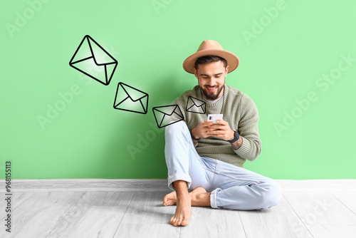 Handsome barefoot man using...