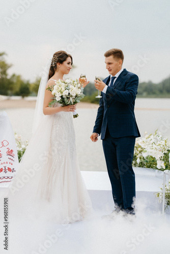wedding ceremony of the newlyweds on the pier
