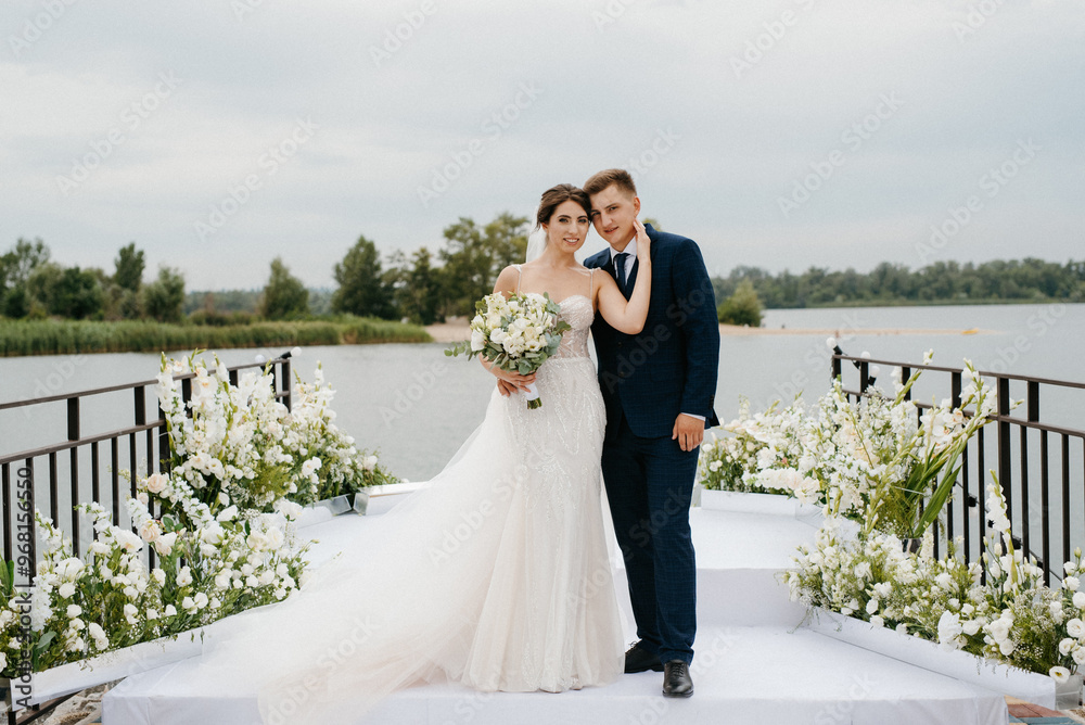 bride and groom against the backdrop of a yellow sunset