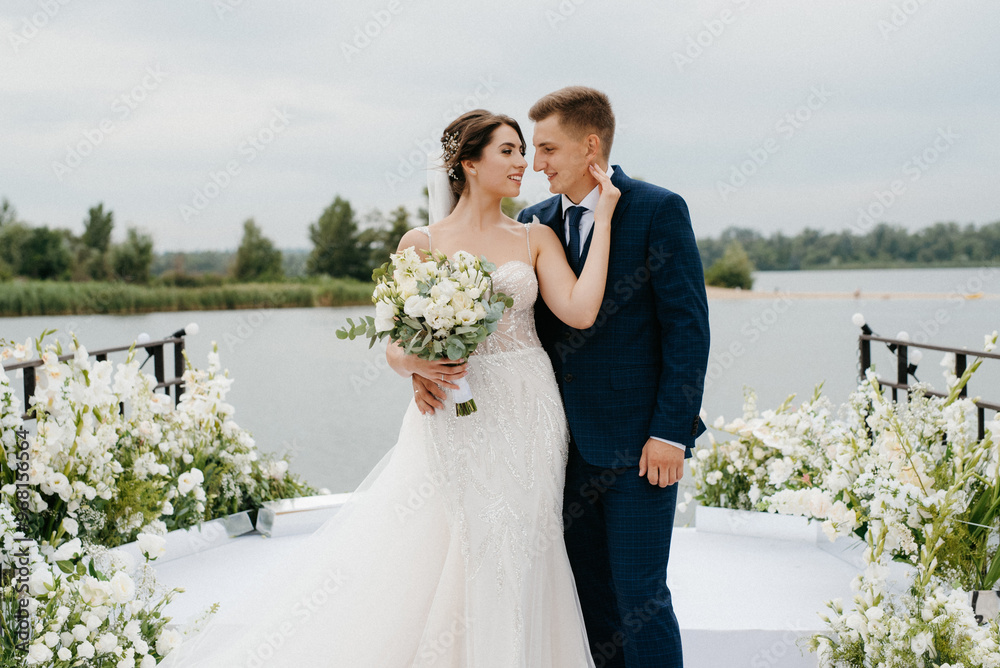 bride and groom against the backdrop of a yellow sunset