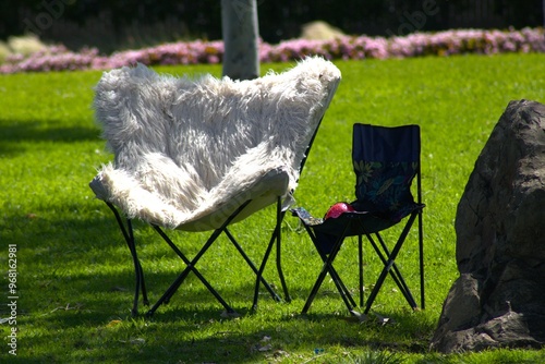 pink fuzzy folding chair next to child chair photo