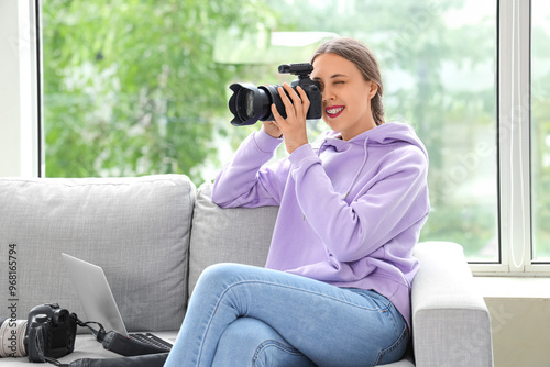 Female photographer with ca...