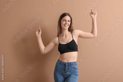Body positive woman on beig...