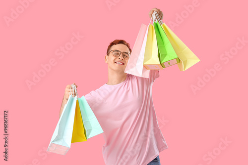 Young man with shopping bag...