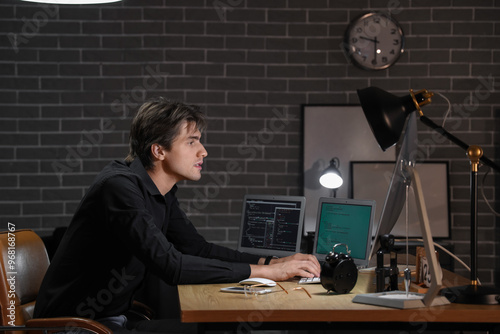 Young male programmer worki...