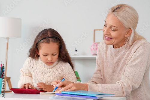 Little girl with her grandm...