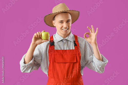 Young farmer with tasty app...