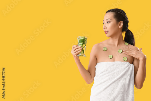 Young Asian woman with glas...