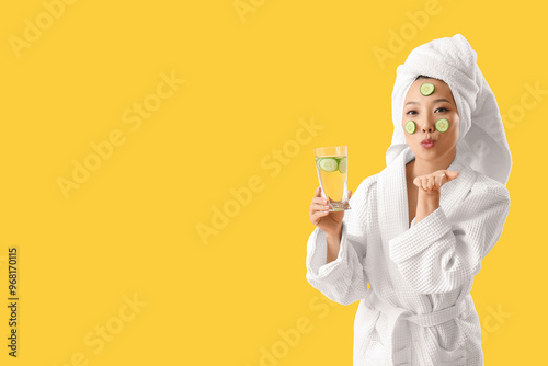 Young Asian woman with glas...