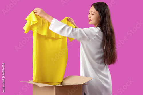 Young Asian woman with new ...
