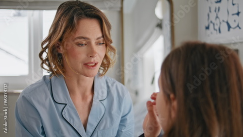 Wallpaper Mural Positive mother talking daughter at modern bedroom closeup. Smiling lady pyjama Torontodigital.ca