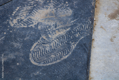 dirt footprint on rubber black surface