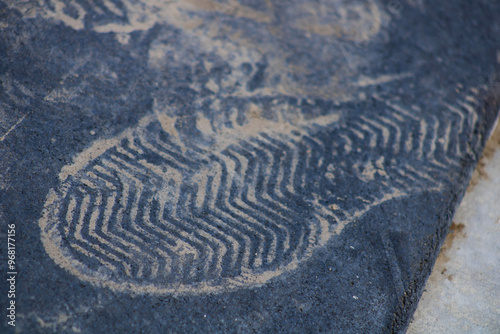 dirt footprint on rubber black surface