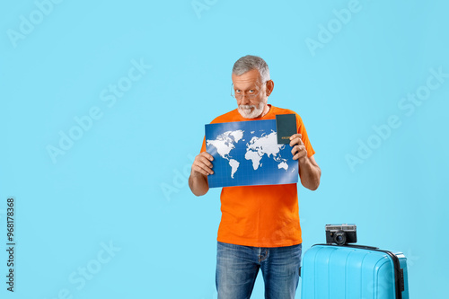 Senior man with suitcase, w...
