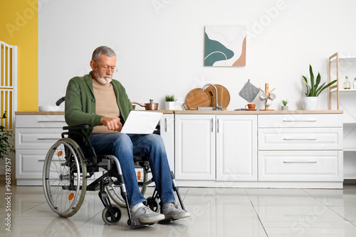 Senior man in wheelchair us...