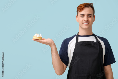 Male confectioner in apron ...
