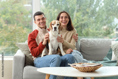 Young couple with cute Beag...