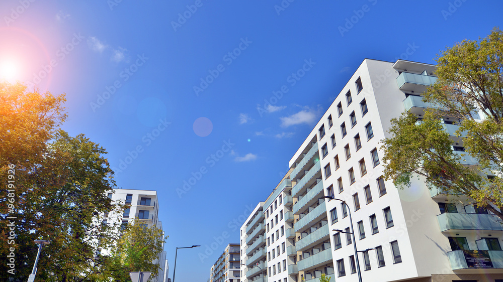 European residential architecture harmonizing with nature. Eco-friendly living in city with greens. Eco apartment building saving energy and fresh air concept. European residential architecture harmonizing with nature. Eco-friendly living in city with greens. Eco apartment building saving energy and fresh air concept.