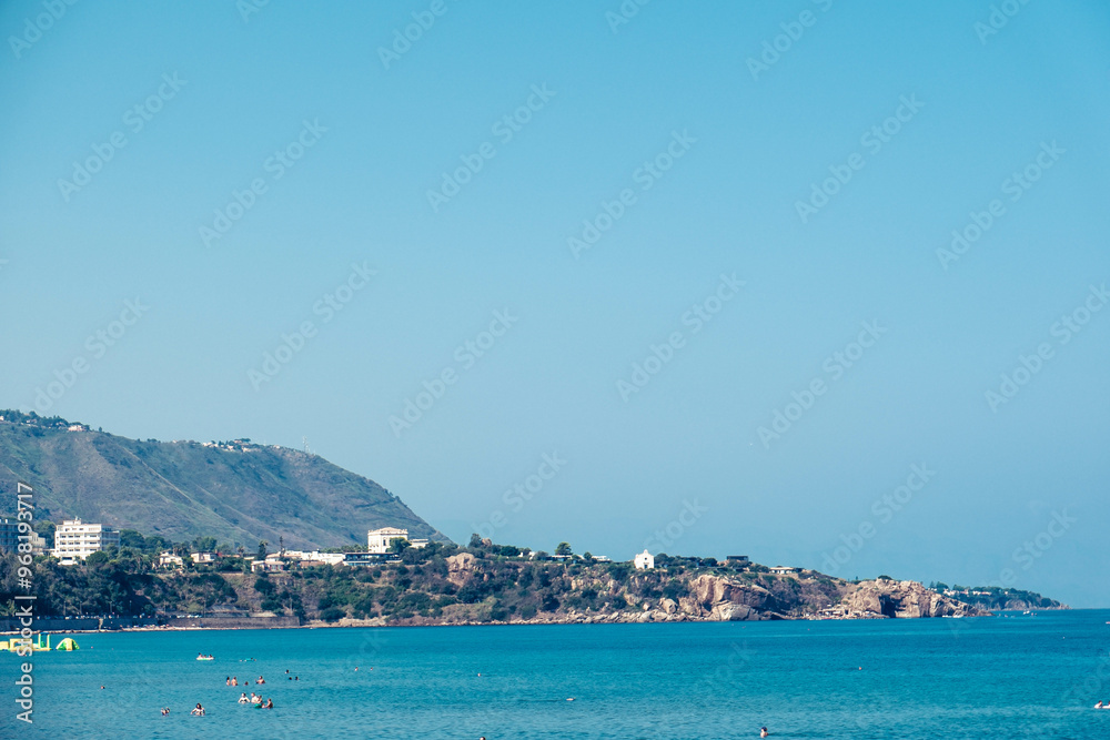 the sandy beaches of Cefalù crowded with tourists in the summer holidays of August the sandy beaches of Cefalù crowded with tourists in the summer holidays of August