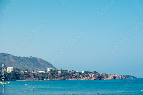 the sandy beaches of Cefalù crowded with tourists in the summer holidays of August