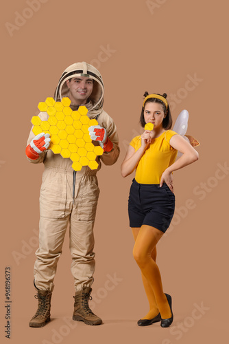 Male beekeeper with paper h...