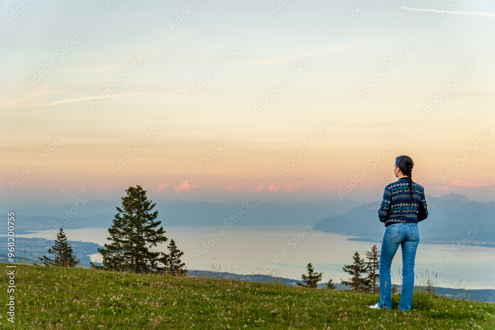 Person admiring sunset over Lake Leman from La Barillette Person admiring sunset over Lake Leman from La Barillette