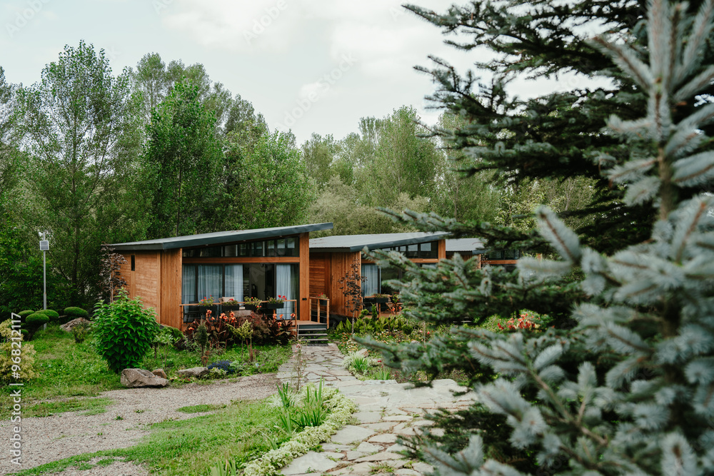 Fotografie Wooden modern hotel cabin in the forest