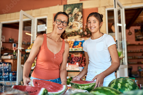 Cuadro en lienzo Mom, girl and happy at shop with watermelon on portrait with support and help in Spain