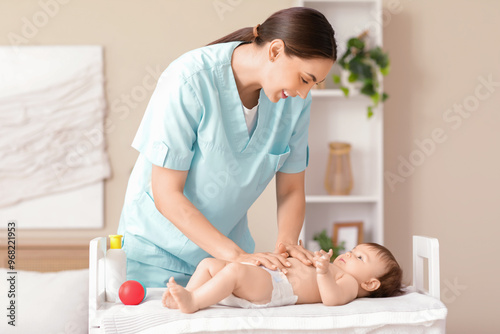 Cute little baby getting be...