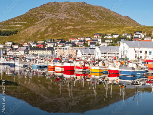 Fishing boats reflected in the harbour at Honningsvag, Norway