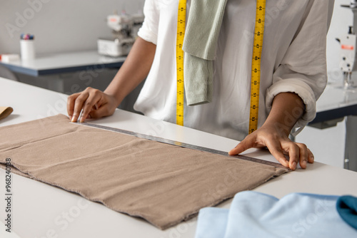 Konstfotografi Woman designer working on fashionable couture handling beautiful fabrics